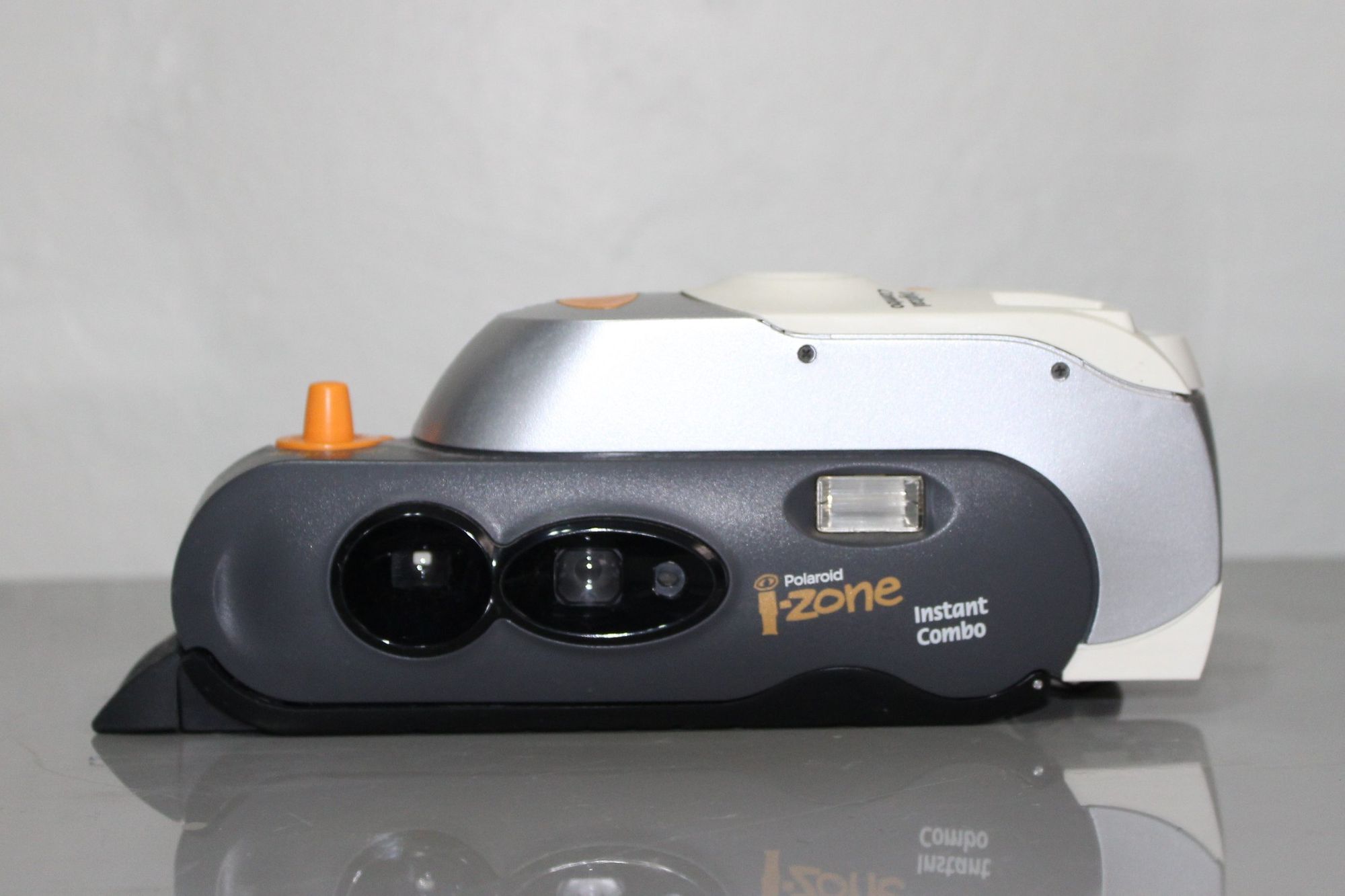 Polaroid i-Zone was a line of toy-like cameras. The “Instant Combo” version combined a film camera with a digital unit.